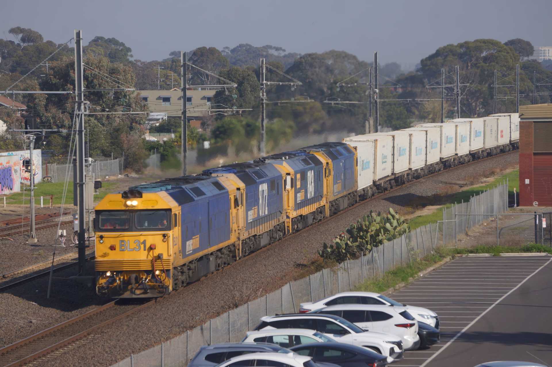 7902V passes Hoppers Crossing Railway Station, bound for Appleton Docks